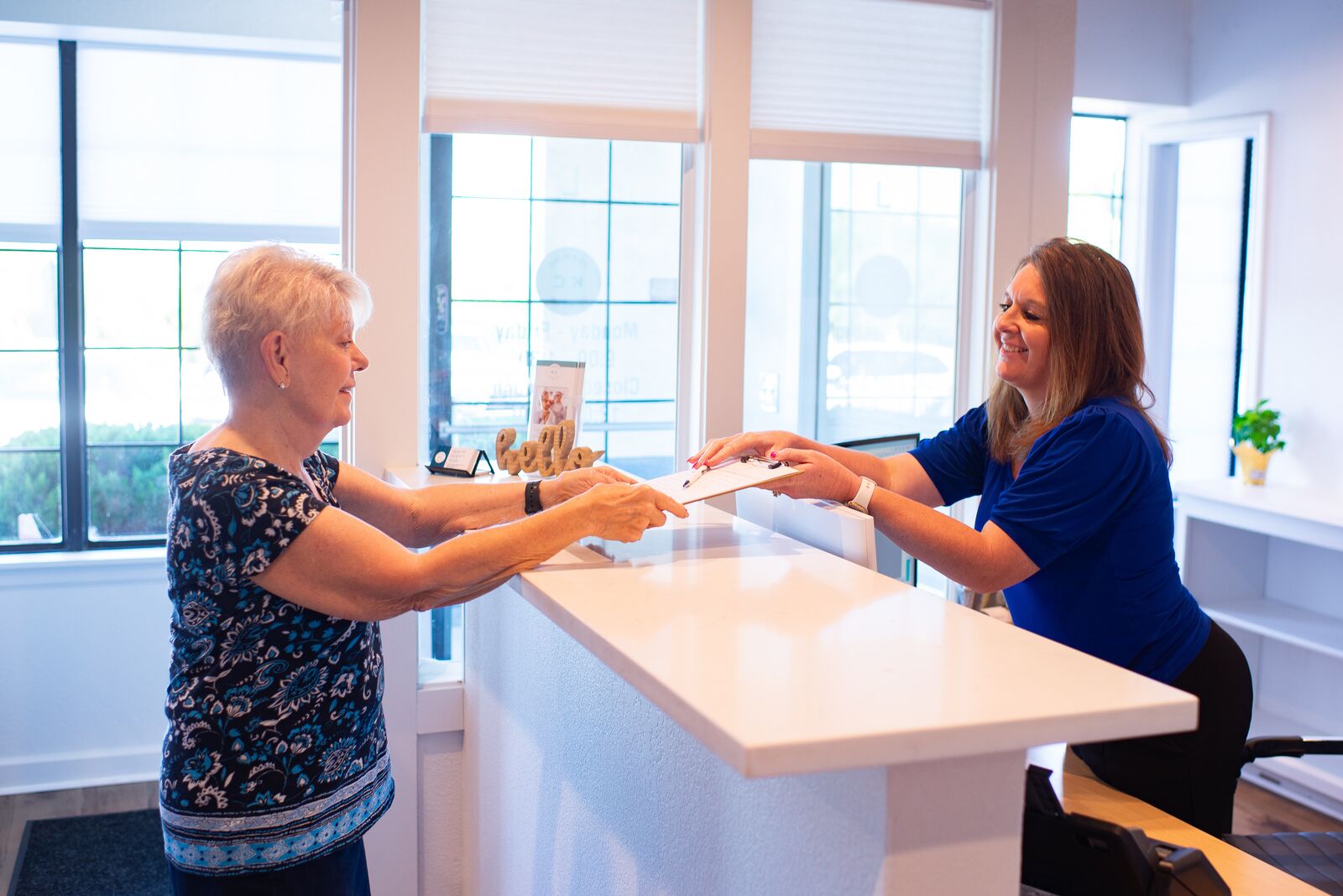 Reception greeting a patient